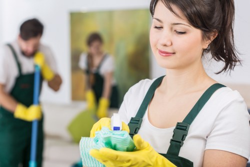 Carpet cleaner handling cleaning chemicals and equipment safely